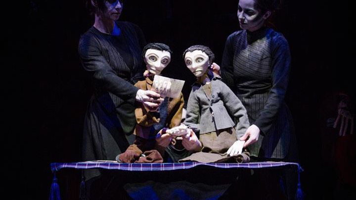 2020 Artist in Residence Dead Puppet Society. 2 cast members on stage with puppets. 